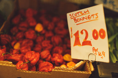 Price tag attached to scotch bonnet box at market stall