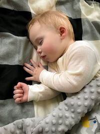 Cute baby sleeping on bed