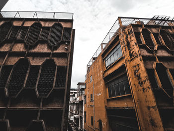Low angle view of old building against sky