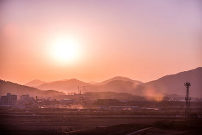 Scenic view of silhouette mountains against sky during sunset