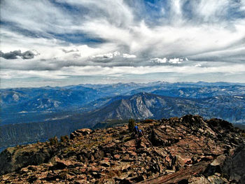 Scenic view of mountains against cloudy sky