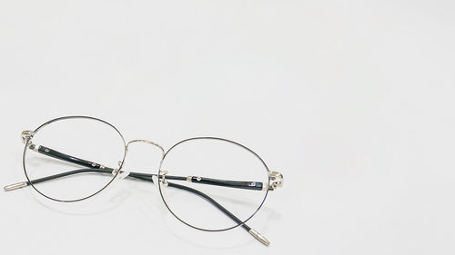 Close-up of eyeglasses against white background