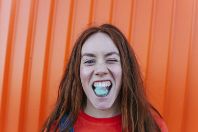 Portrait of beautiful woman with orange hair