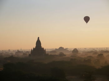 View of temple against sky during sunset