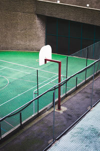 High angle view of basketball hoop by fence