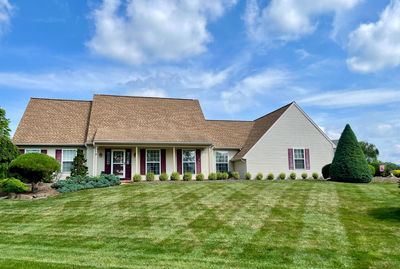 House on field against sky