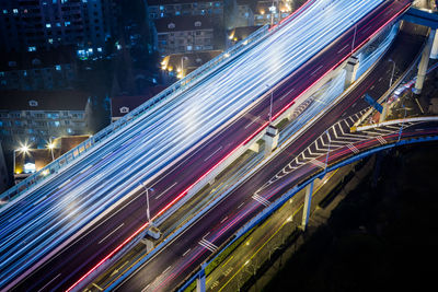 High angle view of light trails on city street at night