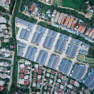 High angle view of swimming pool by buildings in city