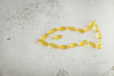 High angle view of yellow cake on sand