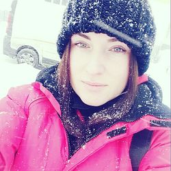 Portrait of young woman in snow