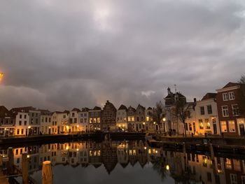 Reflection of illuminated buildings in canal at night