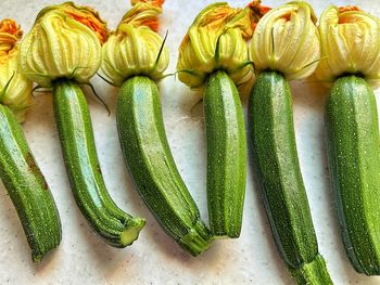 Young zucchini, tiny zucchini with flowers, yellow zucchini flowers, fresh zucchini arranged 