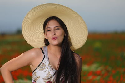 Portrait of a beautiful young woman wearing hat