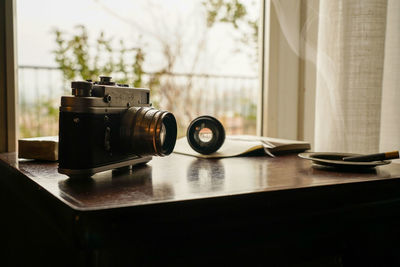 Close-up of camera on table