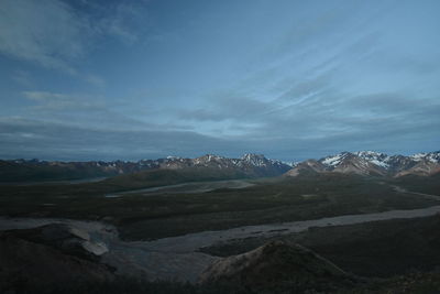 Scenic view of snowcapped mountains against sky
