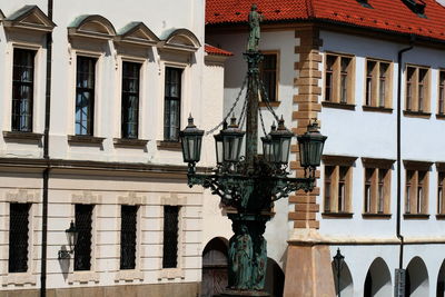 Low angle view of street light against building