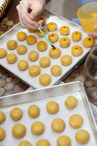 High angle view of person preparing food on tray