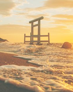 Scenic view of beach against sky during sunset