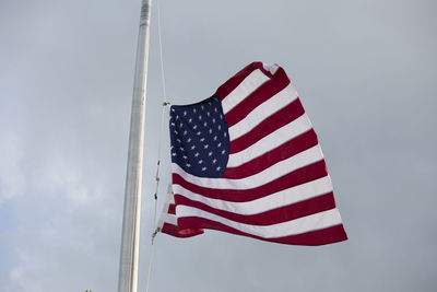 Low angle view of flag against sky