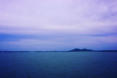 Scenic view of sea against sky at sunset