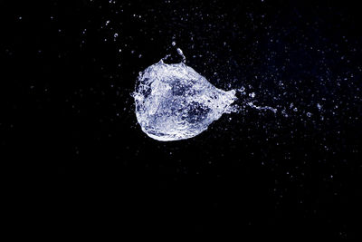 Close-up of splashing water against black background