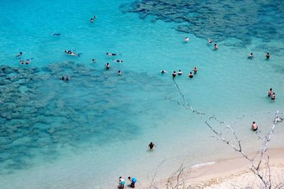 High angle view of people on sea