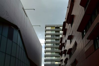 Low angle view of office building against sky