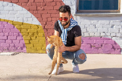 Full length of a young man with dog