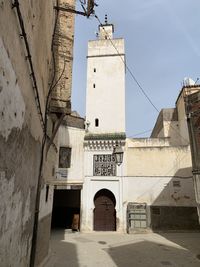 View of minaret on white wash buildings in fez