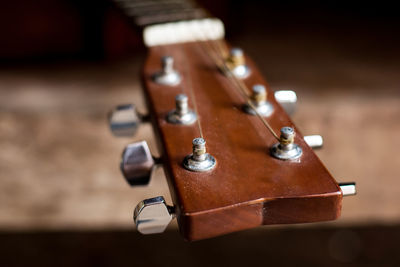 Close-up of guitar on table