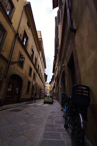 Cars on street amidst buildings in city