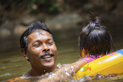 Portrait of smiling woman with water