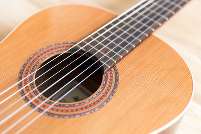 High angle view of guitar on table