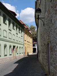 Street amidst buildings against sky