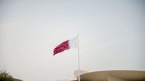 Low angle view of flag against clear sky