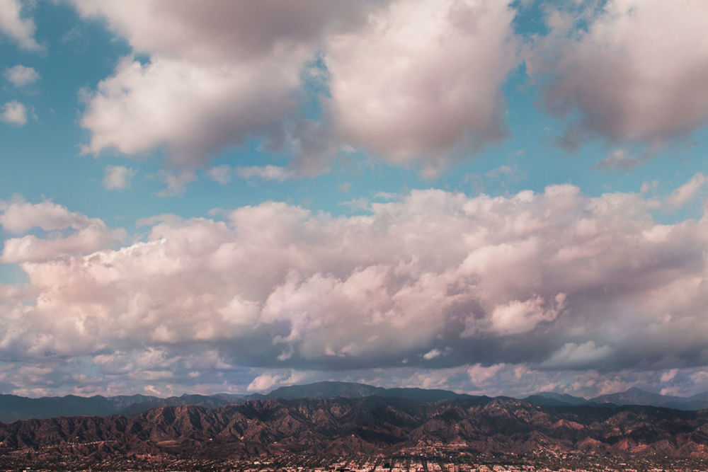 sky, cloud - sky, scenics, cloudy, tranquil scene, mountain, landscape, tranquility, beauty in nature, cloud, nature, mountain range, weather, idyllic, cloudscape, overcast, outdoors, non-urban scene, day, horizon over land