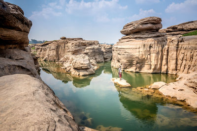 Panoramic view of rock formations against sky