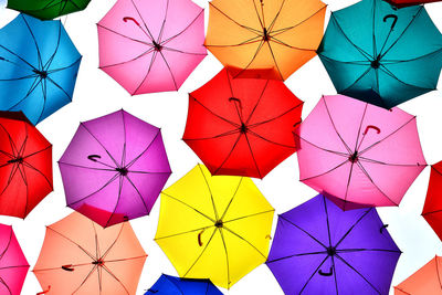 Low angle view of multi colored umbrellas hanging