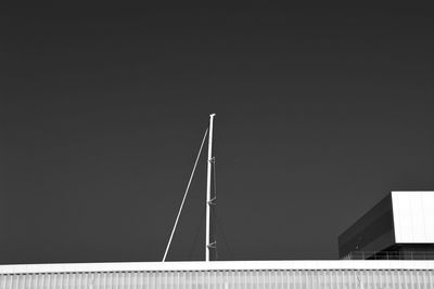 Low angle view of building against clear sky at night