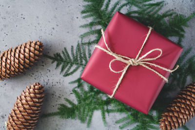 Close-up of christmas decorations and gift box on table