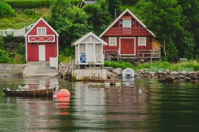 Small colorful fish boat houses in oslo fjord in norway. oslo fjord shore and scandic houses