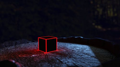 Close-up of red light on table