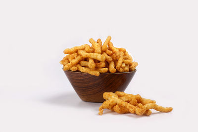 Close-up of burger on plate against white background