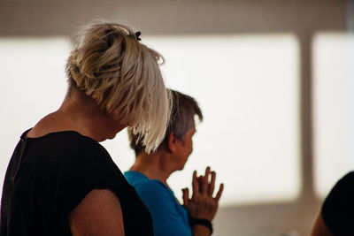 Woman standing against wall