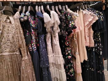 Dresses hanging in store for sale