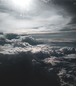 Aerial view of clouds over landscape against sky