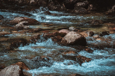 Close-up of water flowing through rocks