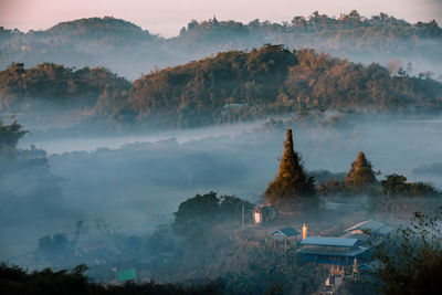 High angle view of trees and buildings against sky