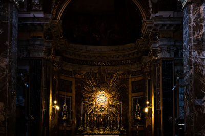 Low angle view of illuminated church interior 