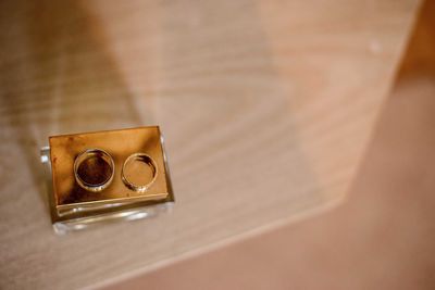 Close-up of wedding rings on table